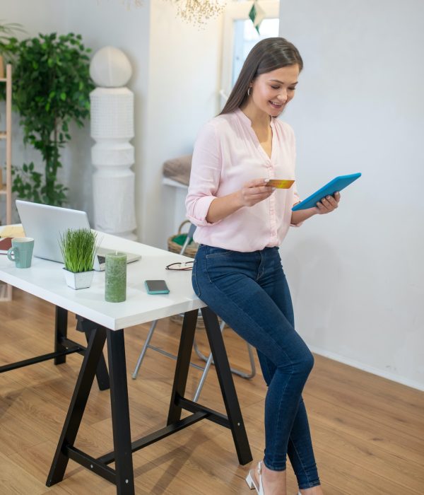 nice-positive-woman-entering-her-bank-card-number.jpg